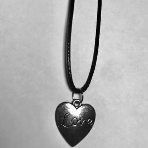 Black cord necklace with silver charm